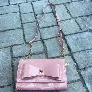 Woman’s pink rose embossed pink Betsey Johnson handbag